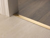 Premier Floating Vinyl Edge — Satin Brass (manufacturer example)